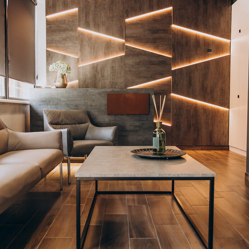 Modern living room with warm lighting and minimalist decor.