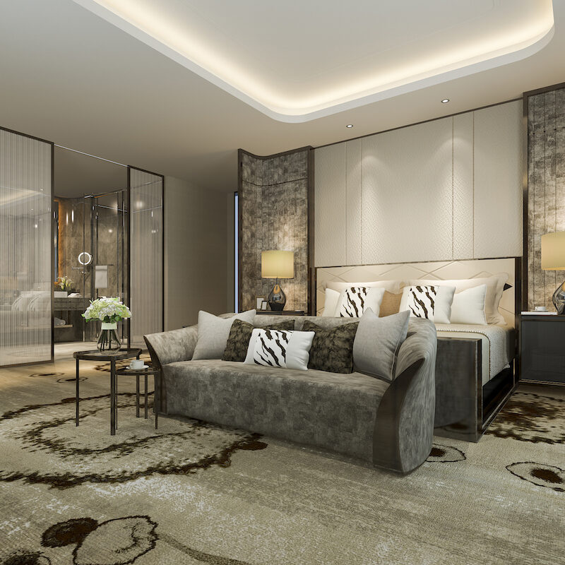 Luxurious hotel bedroom with elegant decor and soft lighting.