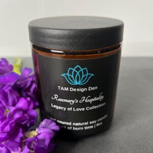 A jar of Tah Design Der Rosemary & Magnolia luxury love candle.