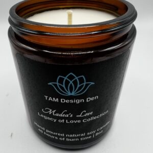 Brown glass candle jar with white text and lotus logo.