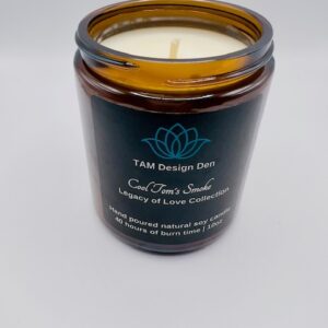 A brown glass jar candle labeled "T&T Design DIY".